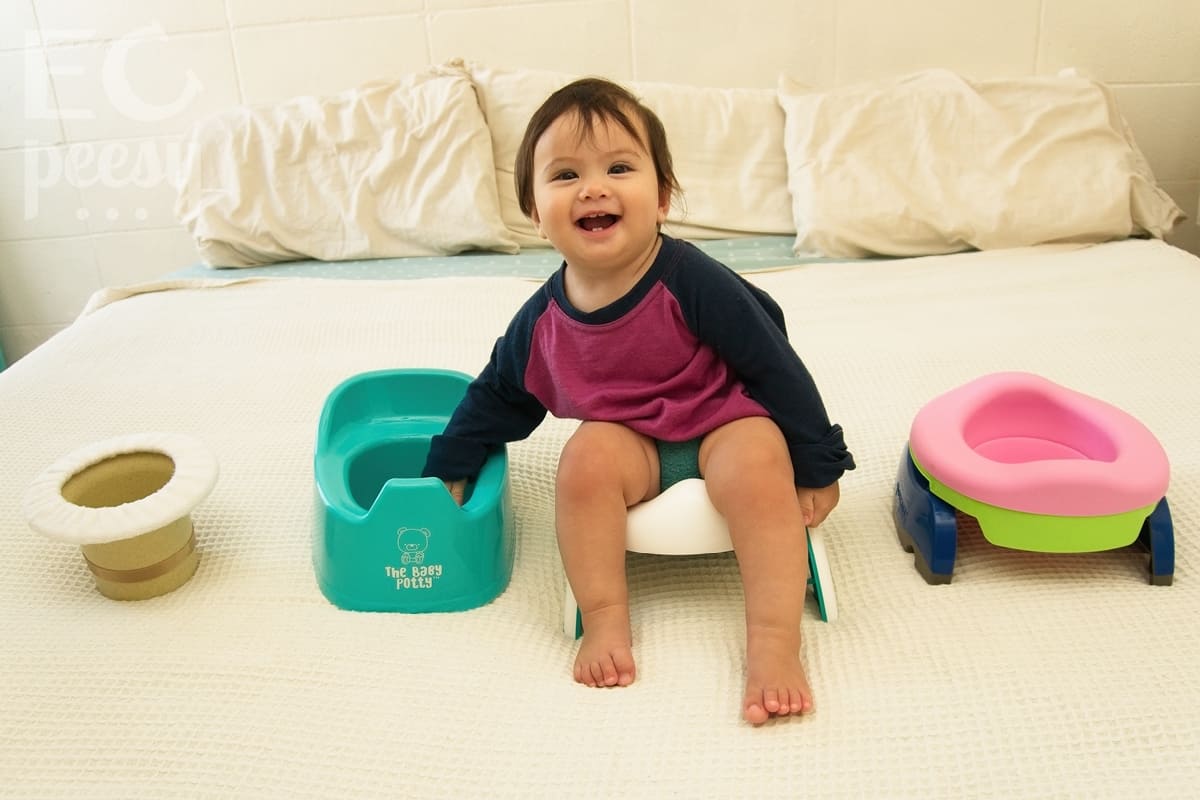 Baby Sitting on the OXO Tot 2-in-1 Go Potty for Travel